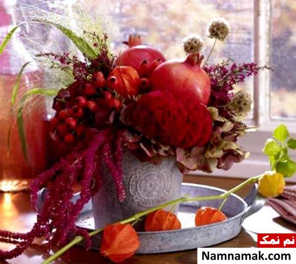 تزیین انار شب چله با گل های مصنوعی